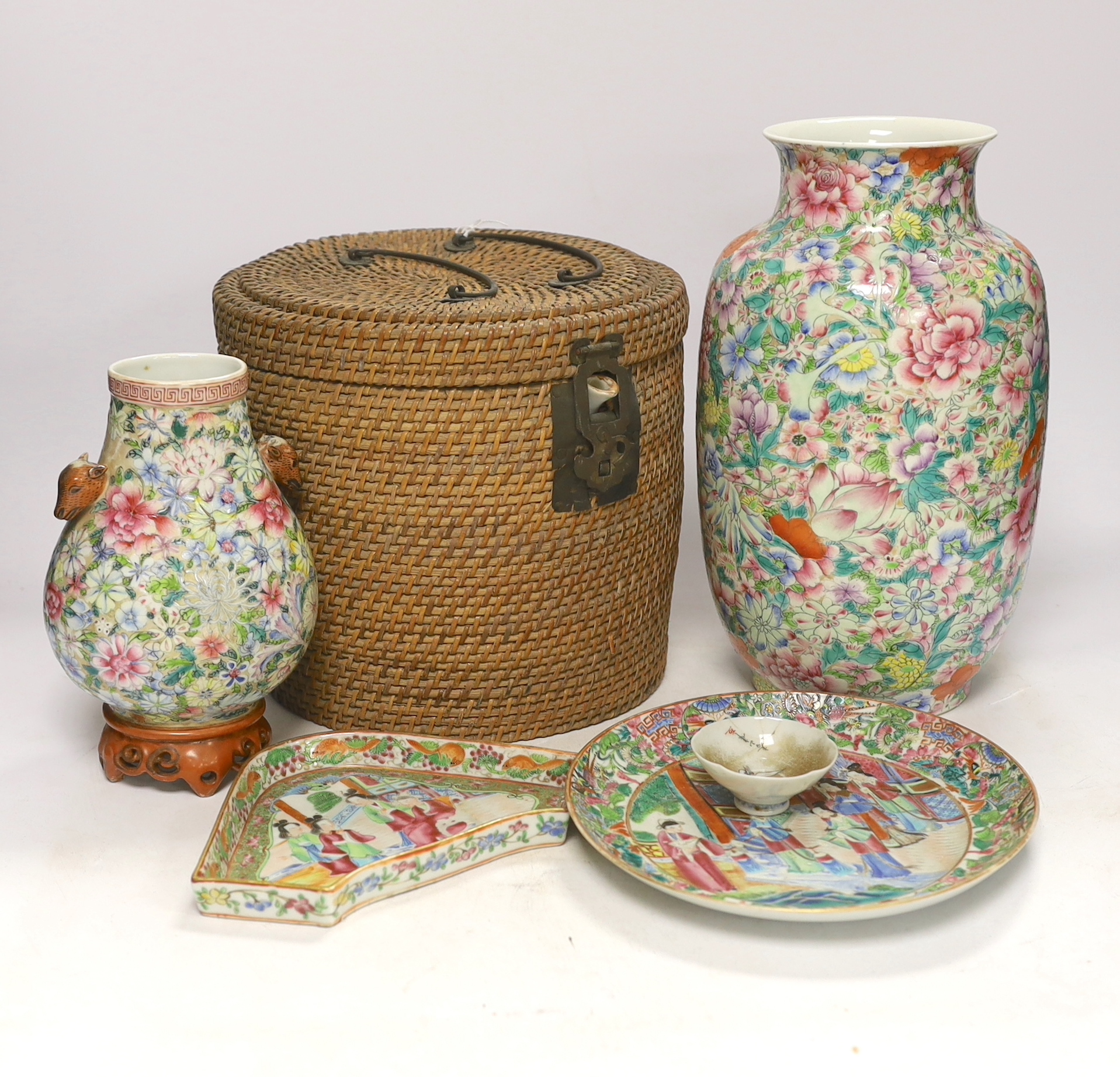 Two Chinese enamelled porcelain Millefleur vases, one with Qianlong Mark, both late 19th/early 20th century, together with two Chinese famille rose dishes and a similar basket cased tea kettle